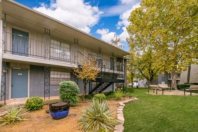 Exterior image of a building, trees, and landscaping